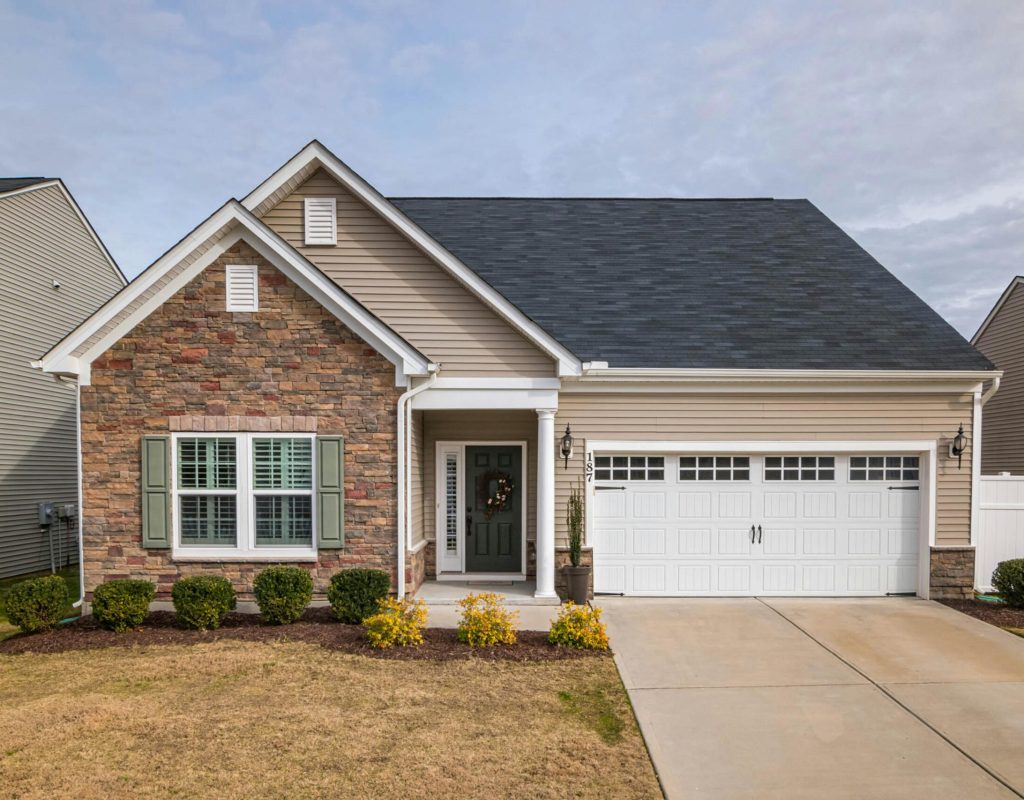 A welcoming suburban family house with a modern facade, perfect for residential living.